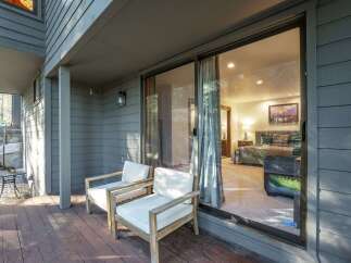 Enjoy the tranquility of this stunning property, featuring a serene outdoor space with comfortable seating.
