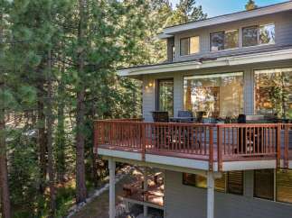 Enjoy the tranquility of nature from this stunning home with a spacious deck.