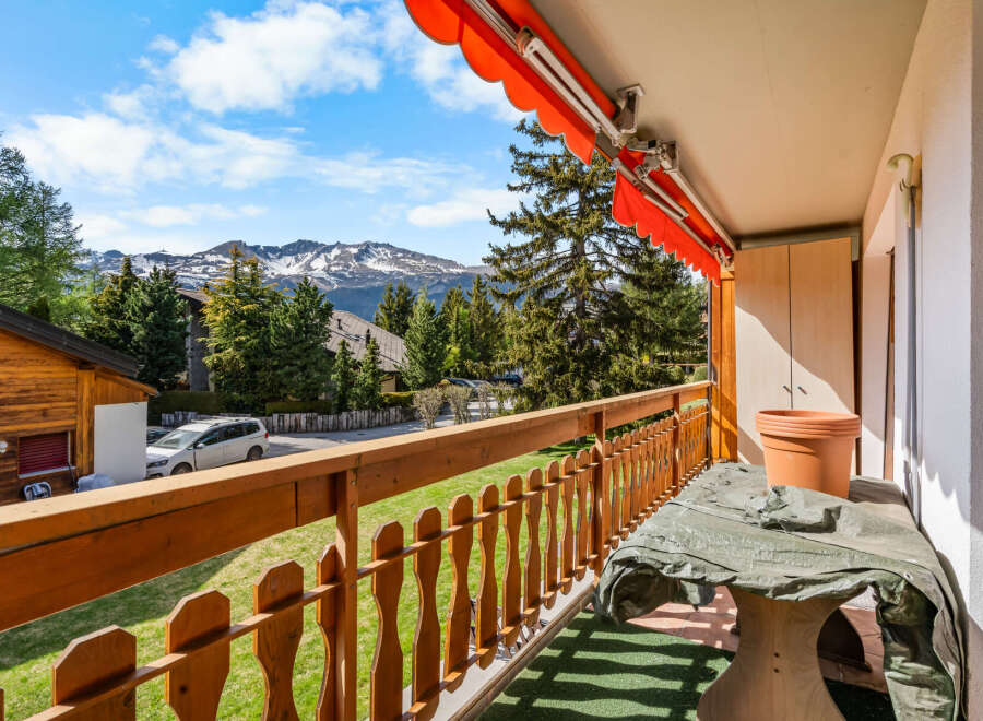 Enjoy breathtaking mountain views from this charming balcony.