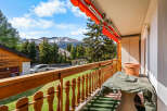 Enjoy breathtaking mountain views from this charming balcony.