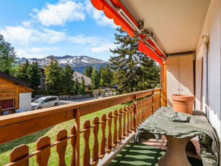 Enjoy breathtaking mountain views from this charming balcony.