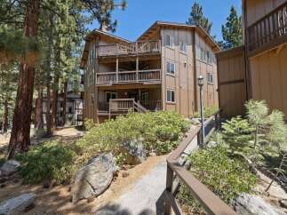 Discover your dream retreat in this stunning multi-story property, boasting multiple balconies and a charming exterior.
