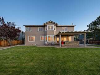 This stunning property boasts a beautifully manicured backyard, perfect for outdoor entertaining and relaxation.