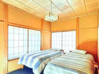 Discover the tranquility of this charming bedroom, perfect for a relaxing retreat.