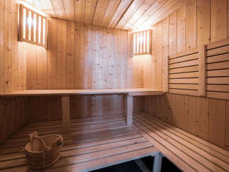 Experience ultimate relaxation in this beautifully crafted wooden sauna.