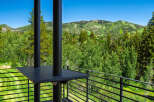 Experience breathtaking mountain views from this stunning property, featuring a spacious balcony perfect for enjoying the serene landscape.