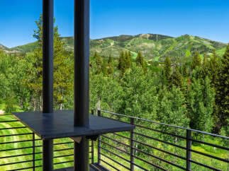 Experience breathtaking mountain views from this stunning property, featuring a spacious balcony perfect for enjoying the serene landscape.