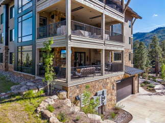 Experience luxury mountain living in this stunning multi-level home, featuring expansive balconies with breathtaking views and outdoor living spaces perfect for entertaining.