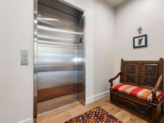 Step into luxury with this stunning property, featuring a sleek, modern elevator for effortless access.