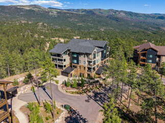 Experience luxury mountain living in this stunning multi-level home, nestled amidst a serene pine forest with breathtaking mountain views.