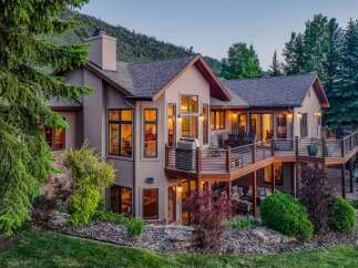 Experience luxury mountain living in this stunning home, featuring expansive multi-level decks perfect for entertaining and enjoying breathtaking views.
