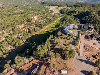 Experience luxury living in this stunning mountain estate, nestled amidst a pristine pine forest and overlooking a scenic golf course.