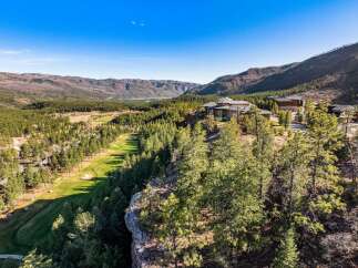 Experience unparalleled luxury in this stunning mountain estate, perched atop a cliff with breathtaking panoramic views.