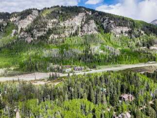 Nestled amidst a vibrant aspen and pine forest, this property offers a serene mountain retreat.