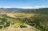 Discover this expansive property offering breathtaking mountain views and a serene natural setting.