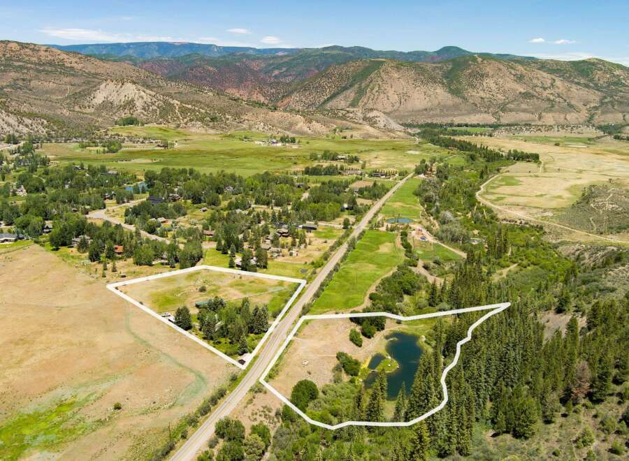 Discover this expansive property featuring two distinct parcels, perfect for development or private enjoyment.