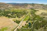 Discover this expansive property featuring two distinct parcels, perfect for development or private enjoyment.