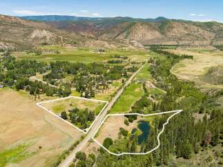 Discover this expansive property featuring two distinct parcels, perfect for development or private enjoyment.