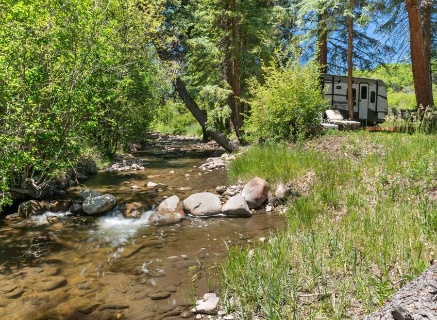Experience serene living with this charming property nestled beside a babbling creek.