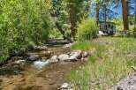 Experience serene living with this charming property nestled beside a babbling creek.
