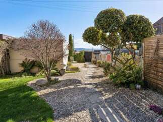 Discover this charming backyard oasis, perfect for relaxation and entertaining.