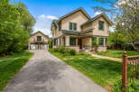 Charming home with a welcoming front porch and a detached garage.