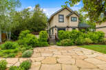 Discover this charming home featuring a beautiful flagstone patio perfect for outdoor entertaining.