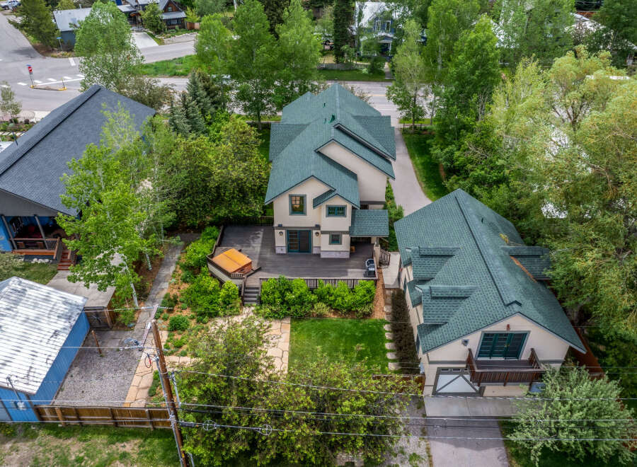 Discover this charming property featuring a spacious deck with a hot tub, perfect for relaxation and entertaining.
