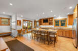 This spacious kitchen boasts a large island with seating, perfect for casual dining and entertaining.