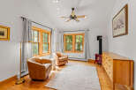 Cozy living room featuring a wood-burning stove with a vibrant red finish, perfect for chilly evenings.