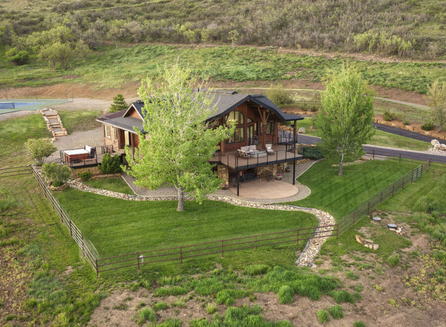 Experience luxury mountain living in this stunning log home, featuring expansive decks perfect for entertaining and enjoying the serene surroundings.