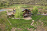 Experience luxury mountain living in this stunning log home, featuring expansive decks perfect for entertaining and enjoying the serene surroundings.