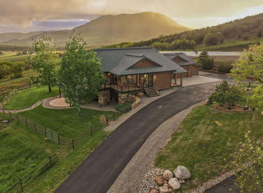 Experience luxury mountain living in this stunning log home, nestled amidst breathtaking natural beauty.