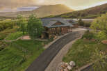 Experience luxury mountain living in this stunning log home, nestled amidst breathtaking natural beauty.