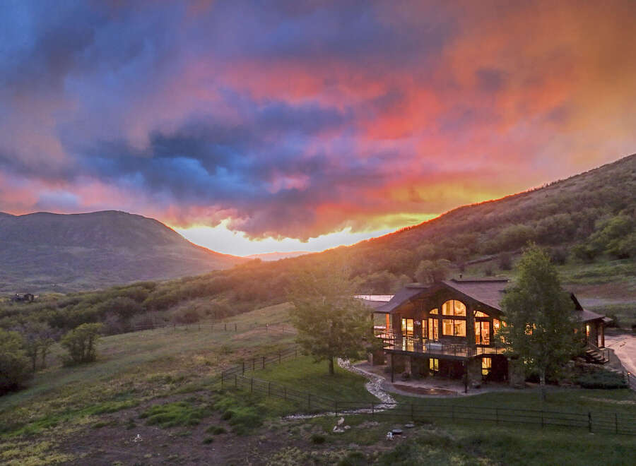 Experience luxury mountain living in this stunning home, perfectly situated to capture breathtaking sunset views.