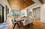 Experience breathtaking mountain views from this stunning open-concept living and dining area.