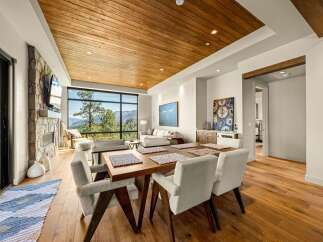 Experience breathtaking mountain views from this stunning open-concept living and dining area.