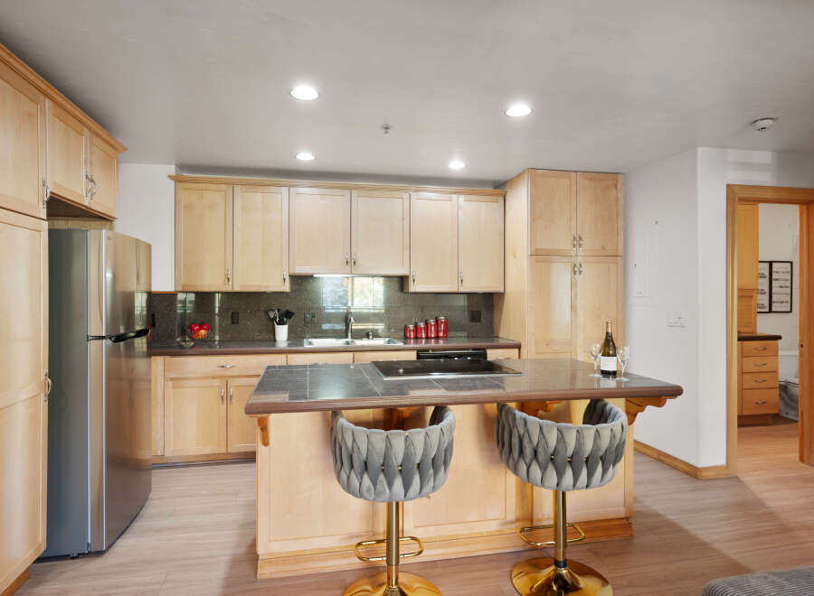 Experience modern living in this beautifully appointed kitchen, featuring sleek stainless steel appliances and ample cabinet space.