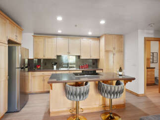 Experience modern living in this beautifully appointed kitchen, featuring sleek stainless steel appliances and ample cabinet space.