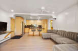 This open-concept living space features a modern sectional sofa perfect for relaxing and entertaining.