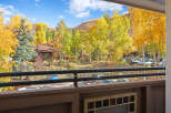 Experience the vibrant beauty of autumn from this charming property, nestled amidst a breathtaking display of golden aspen trees.