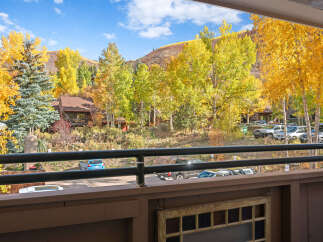 Experience the vibrant beauty of autumn from this charming property, nestled amidst a breathtaking display of golden aspen trees.
