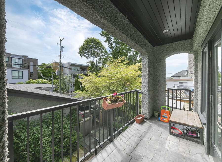 Enjoy outdoor living on this charming balcony, perfect for relaxing or entertaining.