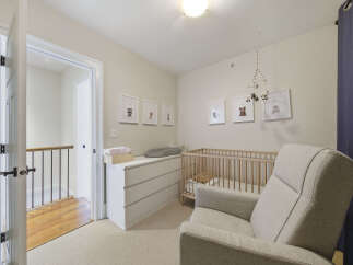 Welcome to this charming nursery, thoughtfully designed for comfort and style.