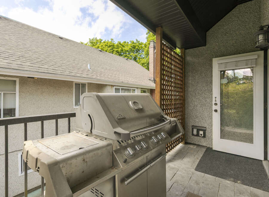 Enjoy outdoor living on this spacious balcony, perfect for entertaining guests.