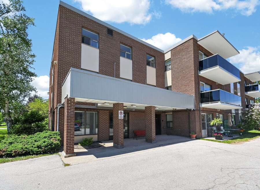 Discover comfortable living in this charming brick building, featuring modern balconies with sleek glass railings perfect for enjoying the outdoors.