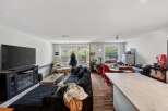 Discover this spacious open-concept living area, perfect for entertaining.