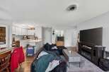 Discover this inviting living space featuring a spacious sectional sofa perfect for relaxation and entertainment.