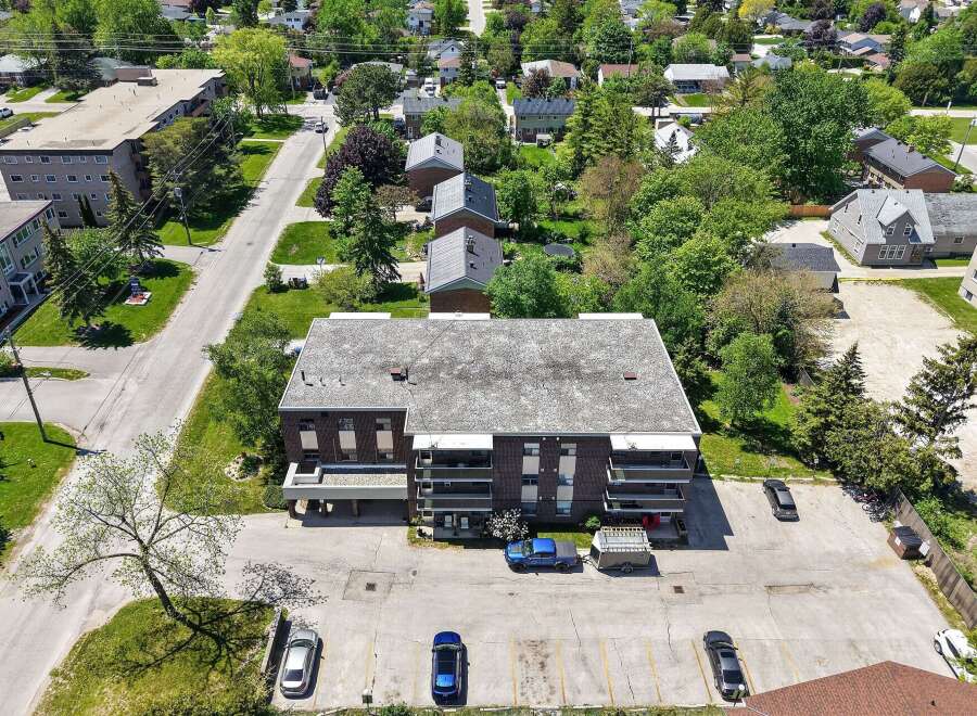 Discover this charming brick apartment building nestled in a serene neighborhood.