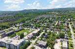Discover this charming suburban neighborhood with a mix of single-family homes and apartment buildings, perfect for families and professionals alike.